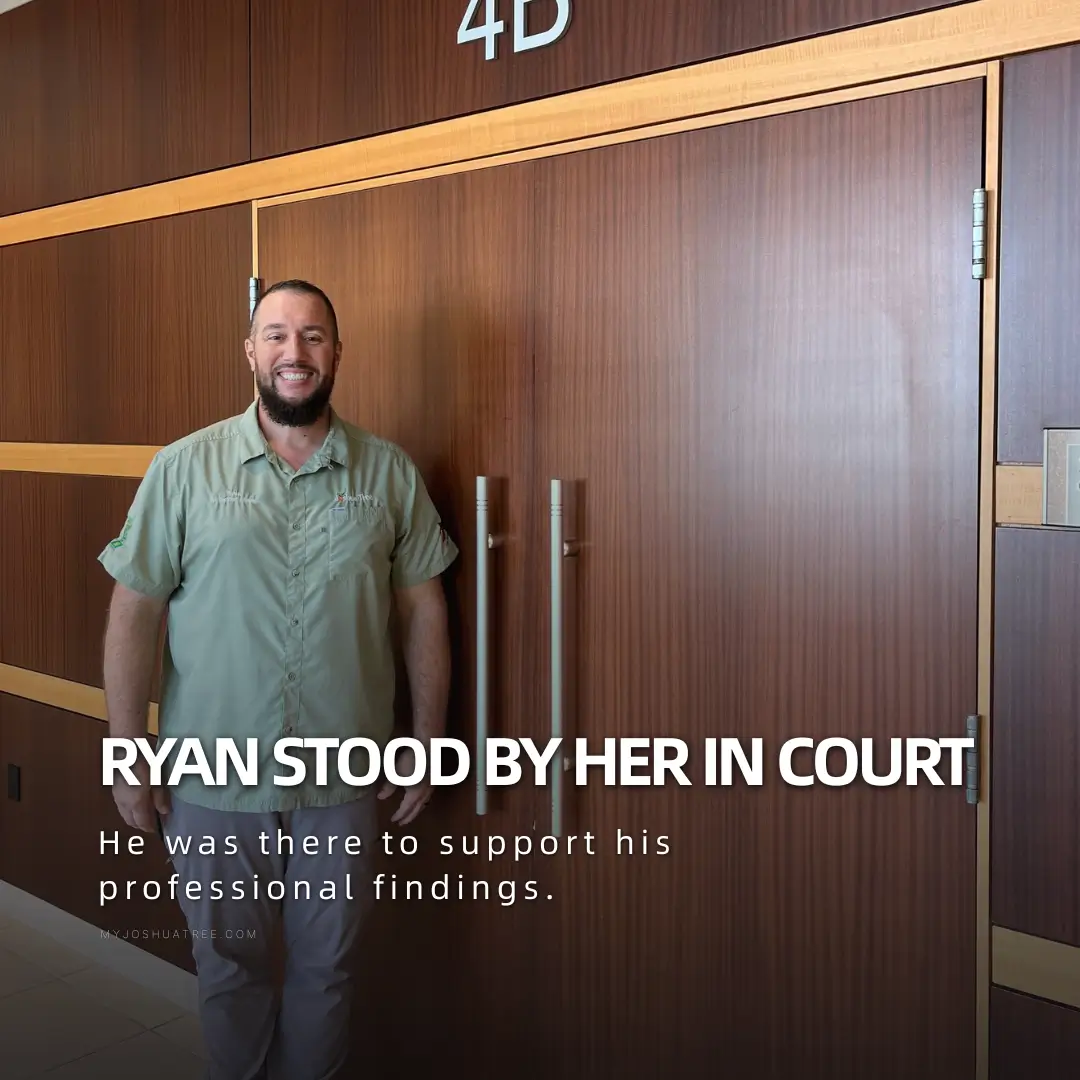 Joshua Tree arborist in a green work shirt standing in front of wooden doors inside a courthouse, overlaid with the text "Ryan stood by her in court."
